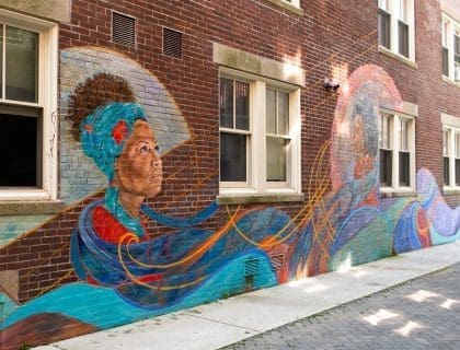Colorful El Espirtu de Ella Mural painted on the side of the Punto Urban Art Museum in Salem MA
