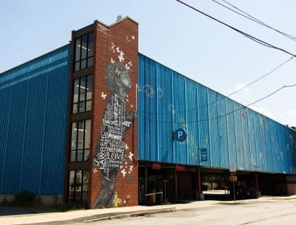 Mural of 4 Year Old Girl Blowing Bubbles on Buckley Transportation Center in Lawrence MA