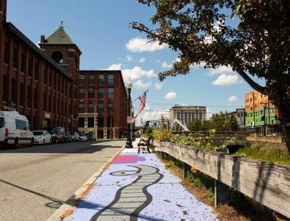 Light Purple Sidewalk Mural in Downtown Lawrence MA