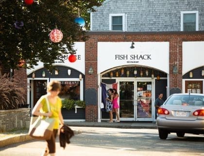 Woman in Yellow Exploring Shops and the Fish Shack in Rockport MA