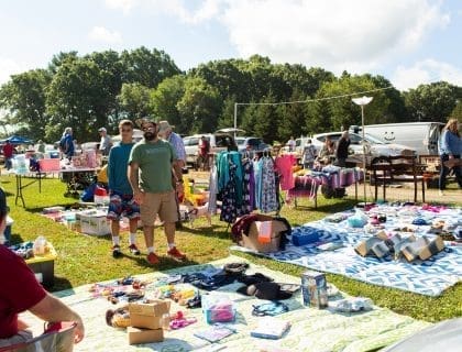 Shoppers Exploring Vendor Stands Outdoors at Todd Farm Flea Market in Rowley MA