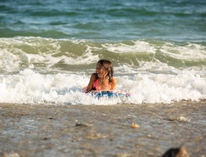 Girl on Boogie Board at a Beach in Marblehead MA
