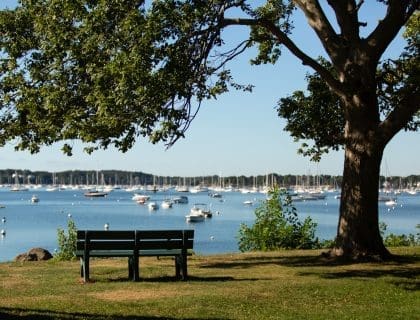 Empty Park Bench Overlooking the Water at The Salem Garden in Winter Island in Salem MA
