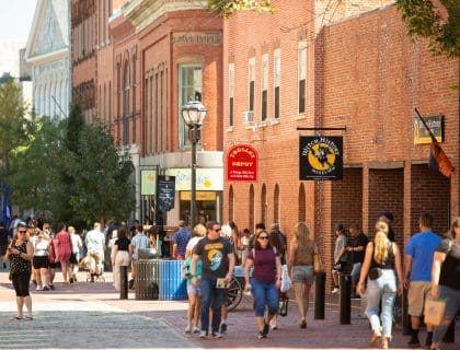 People walking past the Trolley Depot Shop in the historic Salem MA Downtown area