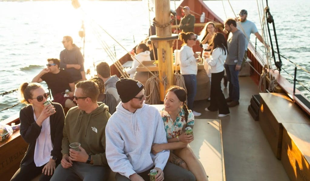 Tourists enjoy sunset on the Schooner Fame