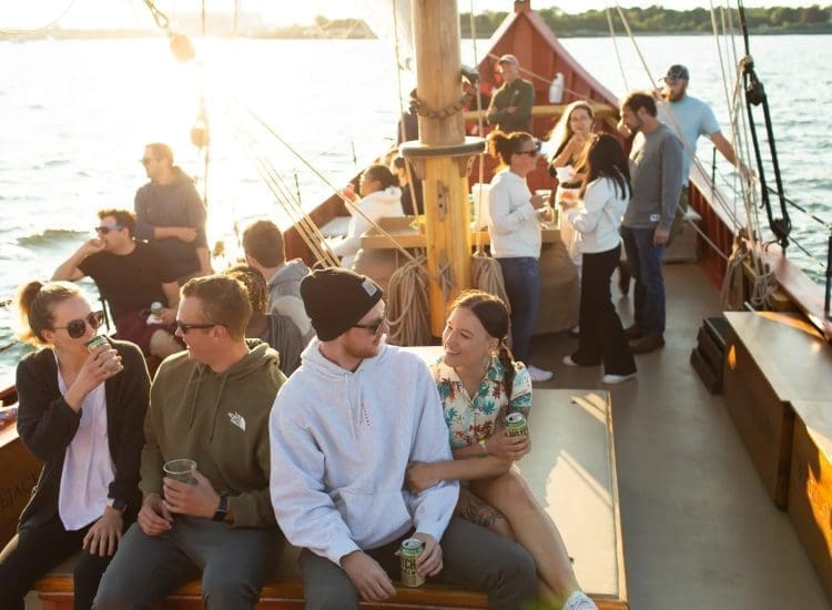 Tourists enjoy sunset on the Schooner Fame