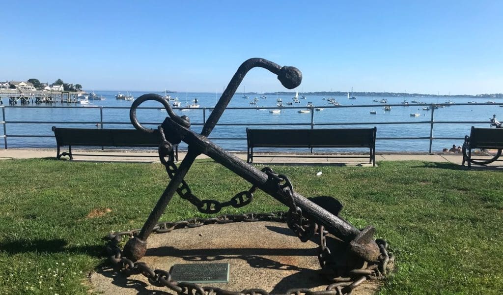 Close up of the large anchor monument in front of Fisherman's Beach on a beautiful blue sky day in Swampscott MA