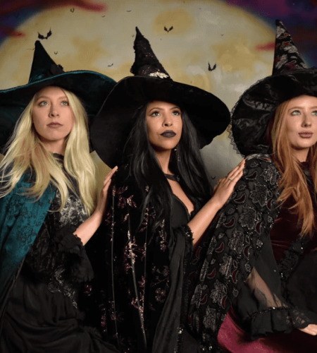 Three women dressed as witches at Witch Pix in Salem, Massachusetts