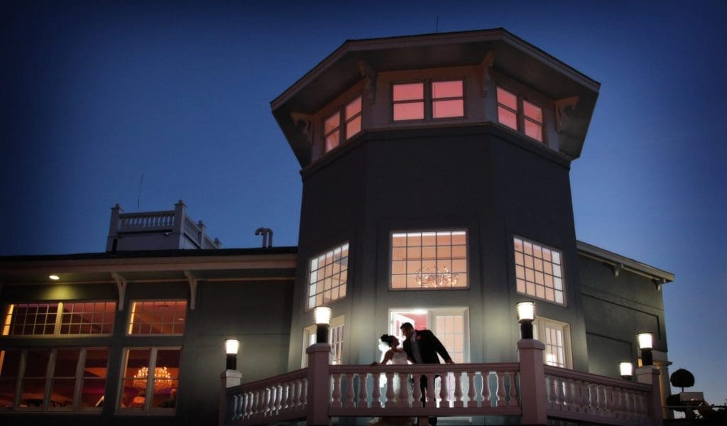 Cruiseport Gloucester night time wedding photo with a bride and groom.