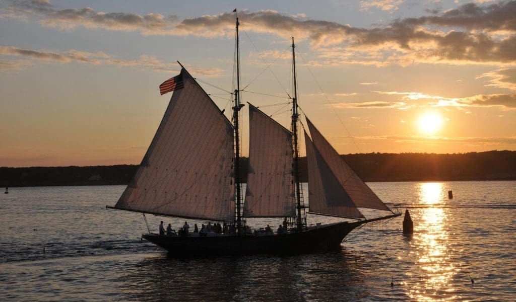 A boat on the ocean at sunset
