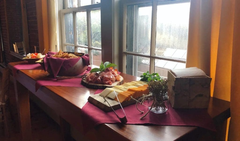 A display of a vareity of appetizers by a window sill in Turner's Seafood in Salem, MA.