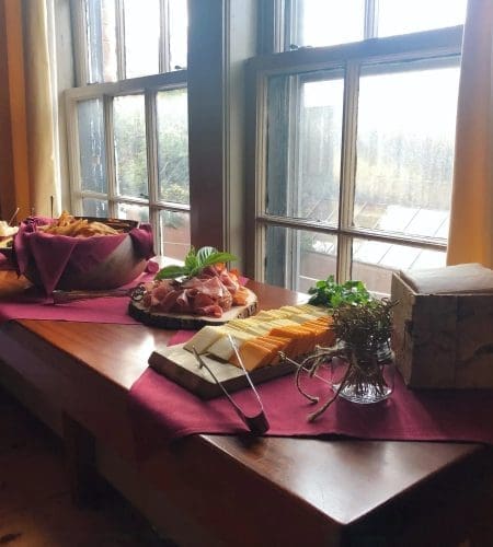 A display of a vareity of appetizers by a window sill in Turner's Seafood in Salem, MA.