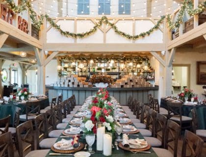 A decorated reception table with green tablecloth