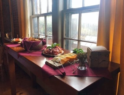A display of a vareity of appetizers by a window sill in Turner's Seafood in Salem, MA.